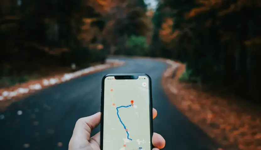 Person using Google Maps in forest illustrating faster GPS acquisition with RR4 and S2
